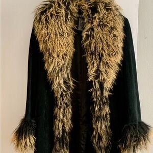 Vintage bebe blue sued coat.  Mongolian fur trim.  Good condition.  Fitted.